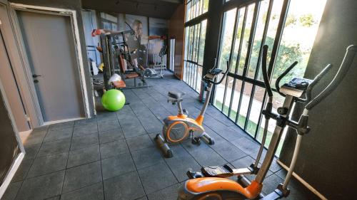 a room with a gym with a scooter on the floor at Zai Jardin in Fethiye