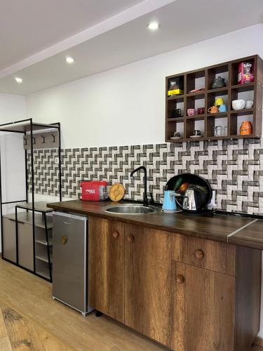 a kitchen with a sink and a counter top at Zani Boutique Hotel in Prizren