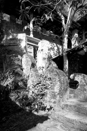 a stone grave with a sign on it at The Kandy Samadhicentre in Kandy