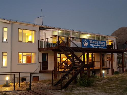 a building with a staircase in front of it at Dune Lodge in Hout Bay