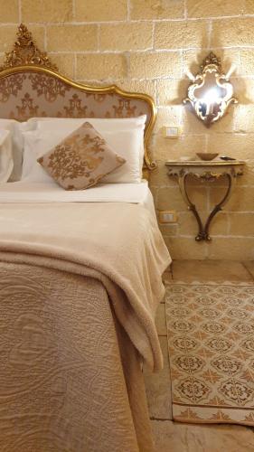 Ліжко або ліжка в номері La casetta del vicoletto