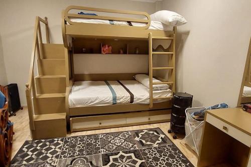 a room with two bunk beds in a room at Sweet home 1 in Mansoura