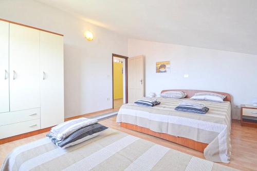 a large bedroom with two beds and a dresser at Panorama Punta in Umag