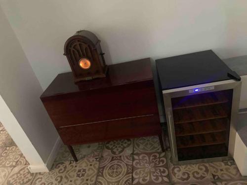 a wooden desk with a candle next to a fireplace at Apartament Raszyn za grosze 