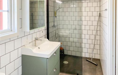 a bathroom with a sink and a mirror at Stunning Home In Kalmar With Kitchen in Kalmar