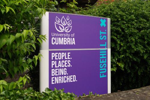 a sign that reads university of guimaraolisolesolesolesplates places being at MMR Homes in Carlisle