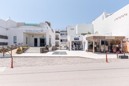a street in a town with white buildings at Naxos Island Hotel in Agios Prokopios