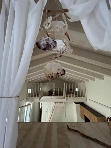 a room with a ceiling with skulls on it at La Casetta in calle in Sottomarina