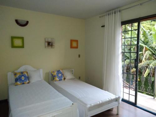 Katil atau katil-katil dalam bilik di Villa Três Picos