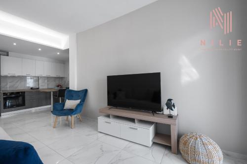 TV a/nebo společenská místnost v ubytování Penthouse Level 7, Nilie Hospitality MGMT