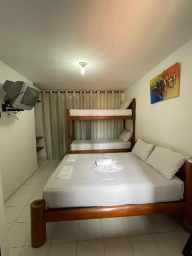 Katil atau katil-katil dalam bilik di Flatmarazul Lindos Apartamentos Privativo com cozinha