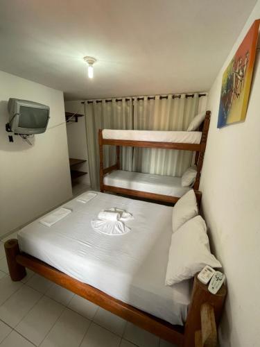 Katil atau katil-katil dalam bilik di Flatmarazul Lindos Apartamentos Privativo com cozinha