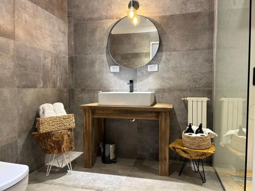 a bathroom with a sink and a mirror at Oeste suites in Mendoza