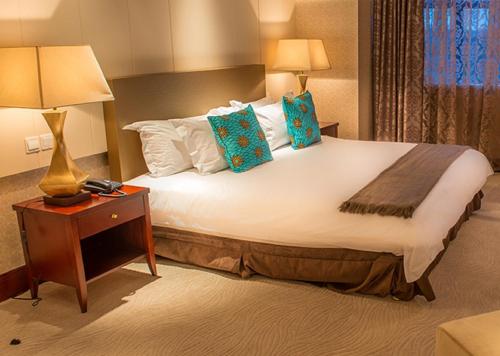 President Hotel at Umodzi Parkにあるベッド