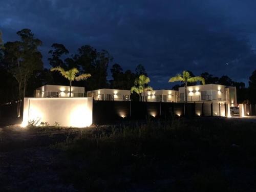 a house lit up at night with lights at Casa para 4 personas en vista24uy, Bella Vista, Maldonado in Bella Vista