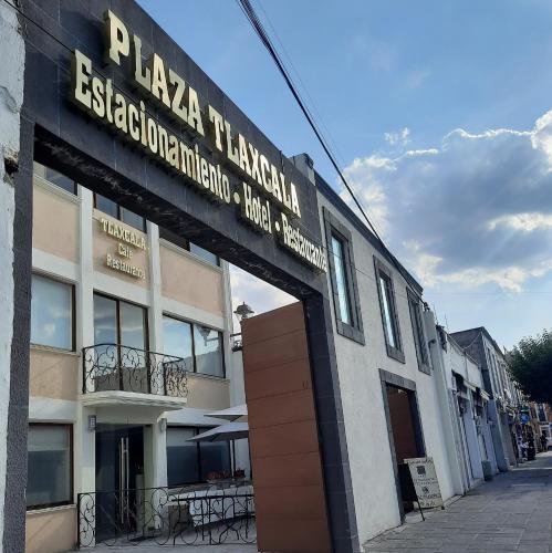 a building with a sign on the side of it at Hotel Tlaxcala in Tlaxcala de Xicohténcatl