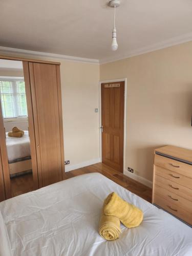 a bedroom with a bed with a towel on it at Cosy 3 Bedroom Home in Notts in Nottingham