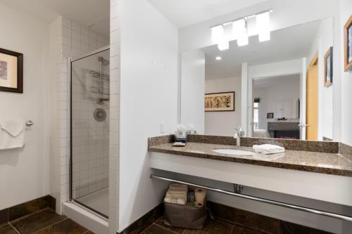 a bathroom with a sink and a shower at Sundial Lodge 2 Bedroom by Canyons Village Rentals in Park City