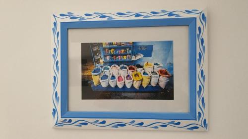 a picture of a group of shoes in a picture frame at Casa Familia in Chefchaouen