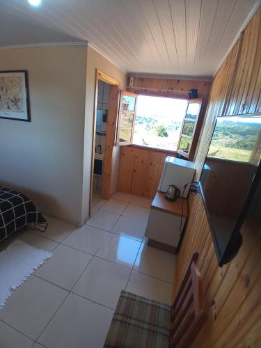 a view of a room with a bedroom and a staircase at Hotel cabanas bom Jesus in Ametista do Sul