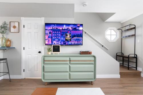 a green dresser in a room with a staircase at Fun2b1.5ba-central Mesa-community pool/spa in Mesa