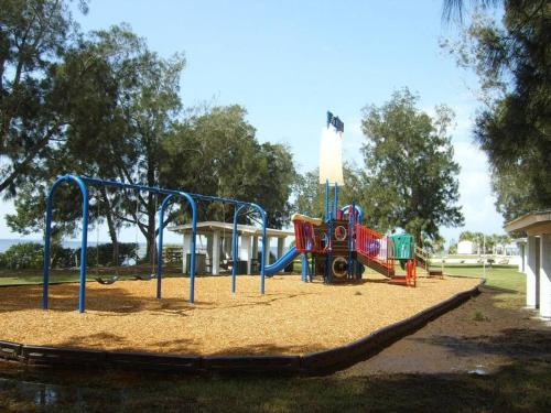 a playground in a park with a train on it at Spacious 3BR Family Home Near Sponge Docks in Tarpon Springs