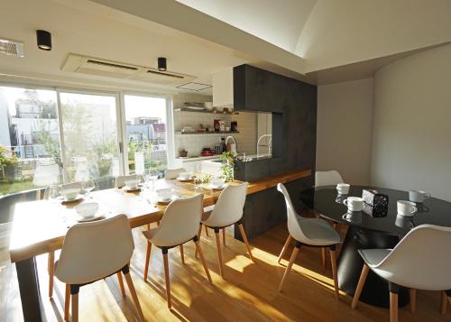 a kitchen and dining room with a table and chairs at Stay Well & Give Well, Full Building in Asakusa in Tokyo