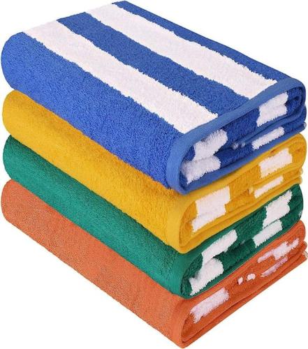 a stack of colorful towels stacked on top of each other at LUXURIOUS APARTMENT IN LEVENT FRONT EAGLE BEACH in Palm-Eagle Beach