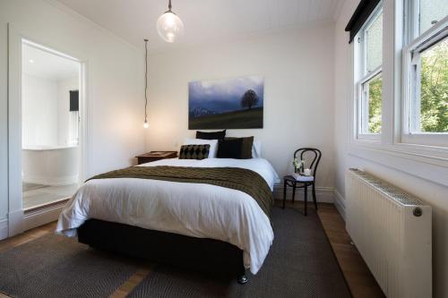 Ένα ή περισσότερα κρεβάτια σε δωμάτιο στο Annecy House