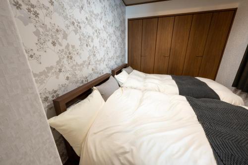 Katil atau katil-katil dalam bilik di neige furano Vacation rented house