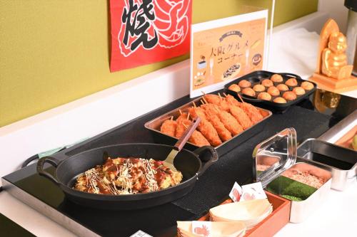 a buffet with some food on a table at Hotel the Lutheran in Osaka