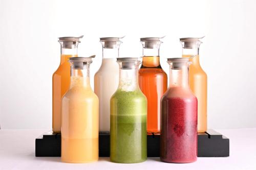 a group of bottles of different colored liquids at Hotel the Lutheran in Osaka