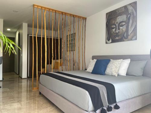 a bedroom with a large bed in a room at Menesse Midtown 2 206 y 209 in Playa del Carmen