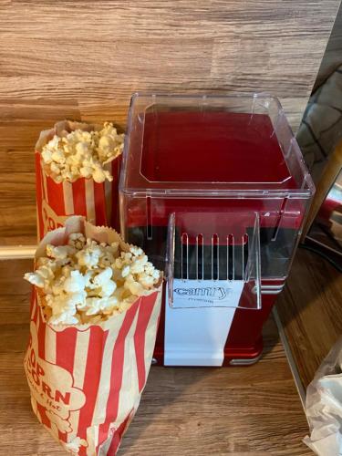 two containers of popcorn and a container of popcorn at Perland Vacation in Sidari