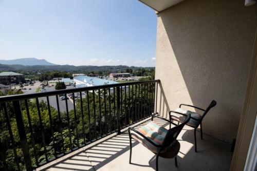 a balcony with a bench and a view at MVC - Unit 1302 - The Cove in Pigeon Forge