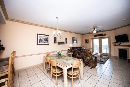 a dining room with a table and chairs at MVC - Unit 1302 - The Cove in Pigeon Forge