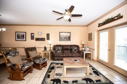 a living room with a couch and chairs and a ceiling fan at MVC - Unit 1302 - The Cove in Pigeon Forge