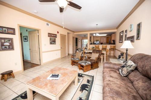 a living room with a couch and a table at MVC - Unit 1302 - The Cove in Pigeon Forge