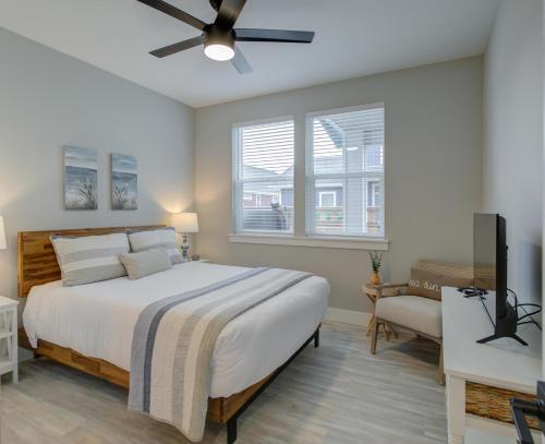 a bedroom with a bed and a ceiling fan at Blue Ocean Bungalow in Ocean Shores