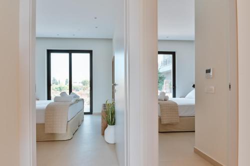 Katil atau katil-katil dalam bilik di Melior Luxury Villas