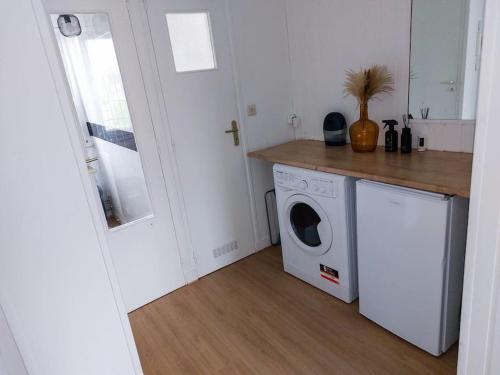 a kitchen with a washing machine and a counter at Le Sympathique in Rouen