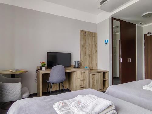 Una cama o camas en una habitación de Willa Rustykalna