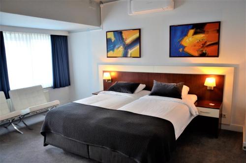 Postel nebo postele na pokoji v ubytování Apollo Hotel