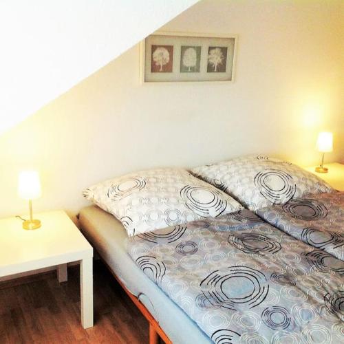 Giường trong phòng chung tại Gemütliche 2 Zimmerwohnung mit tollem Ausblick