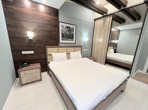 Ένα ή περισσότερα κρεβάτια σε δωμάτιο στο Resident Hotel Gogol