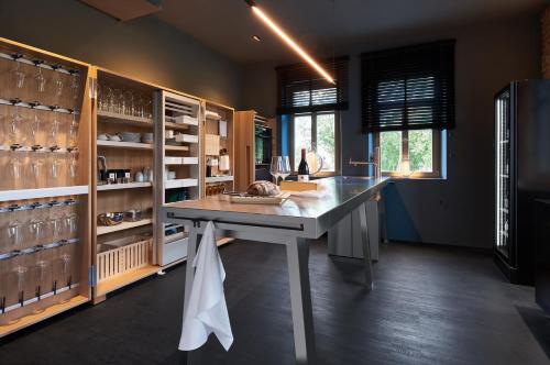 a kitchen with a large table in a room at Mittermeiers Alter Ego in Rothenburg ob der Tauber