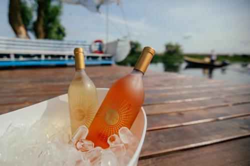 two bottles of wine sitting on top of a table at WPO - WILD PIKE OASIS in Caraorman