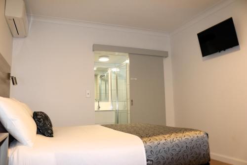 Cama o camas de una habitación en Childers Oasis Motel
