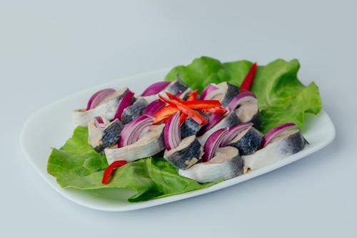 a plate of chicken salad with lettuce and red peppers at WPO - WILD PIKE OASIS in Caraorman