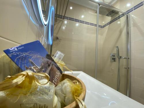 a basket of groceries sitting on a bathroom sink at Alvor Seven 10 in Alvor